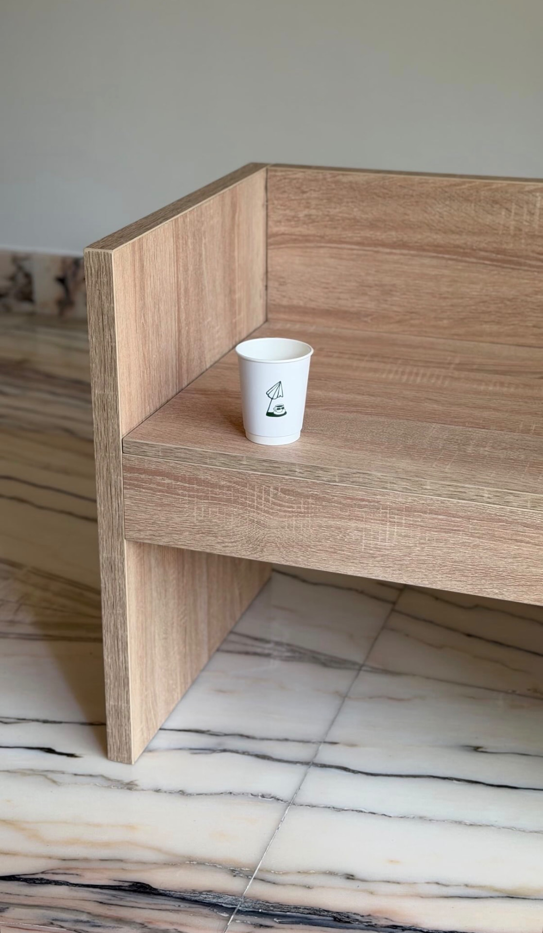cafe oomph cup on an oak bench